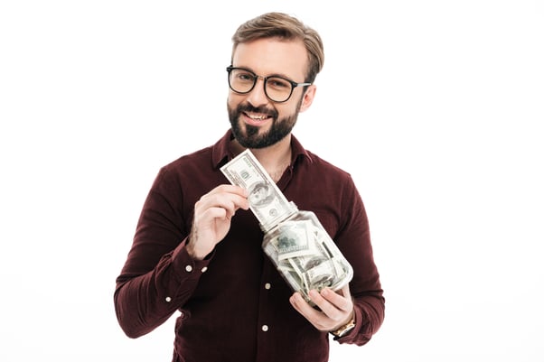 Happy man holding money in hands